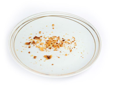 An empty plate with cookie crumbs